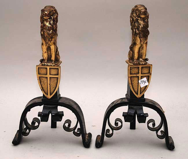 Pair of brass and iron andirons, lion form with sh: Pair of brass and iron andirons, lion form with shield, 19 1/2"h