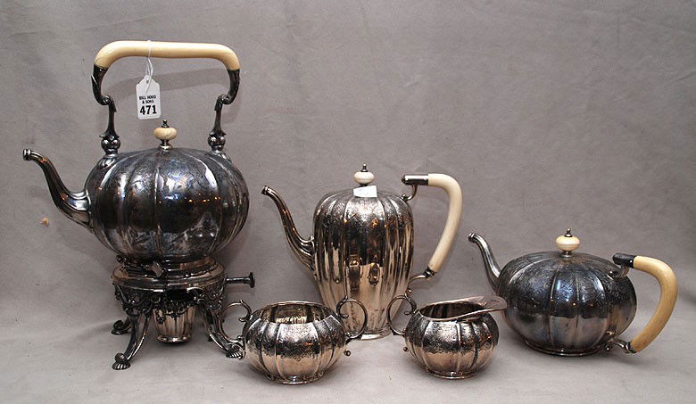 Sterling silver 5 pc. tea service, Mappin & Webb (: Sterling silver 5 pc. tea service, Mappin & Webb (Sheffield) consisting of the following; teapot with ivory handle (5"h) coffee pot with ivory handle (7 3/4"h) footed hot water kettle on stand with iv