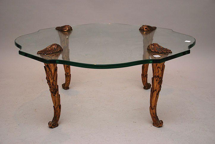 Coffee table, gilt metal legs with free form glass: Coffee table, gilt metal legs with free form glass top