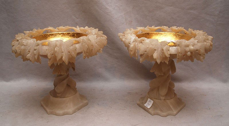 Pair of alabaster tazza compotes, restoration to a: Pair of alabaster tazza compotes, restoration to a small part of vine on top of one of the piece, 9"h x 10"w