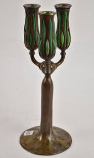 Tiffany Art Nouveau bronze and favrille glass table candelabra, having 3 arms with green blown-out: Tiffany Art Nouveau bronze and favrille glass table candelabra, having 3 arms with green blown-out reticulated glass, removable bobeches, central form stem, marked on bottom Tiffany Studios, New York,