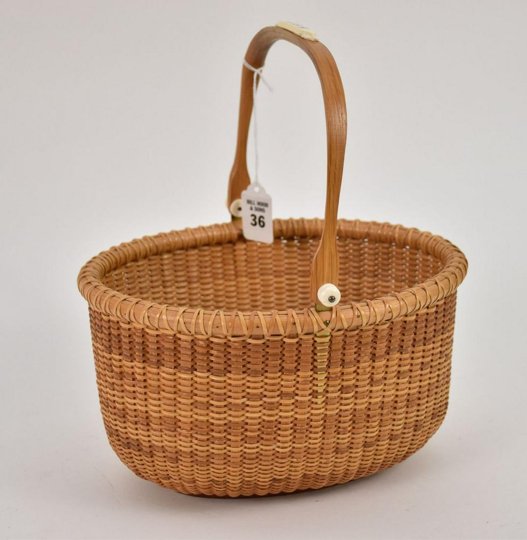 Nantucket Basket with Swing handle with bone, monogram at handle, Signed bottom reads: Made by: Nantucket Basket with Swing handle with bone, monogram at handle, Signed bottom reads: Made by Jeanne Reis Nantucket Island