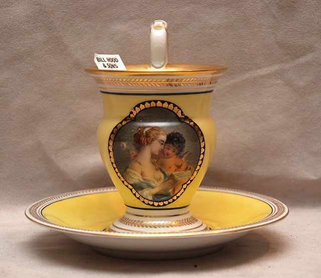Porcelain cup and saucer, mother and child on yello: Porcelain cup and saucer, mother and child on yellow ground gilt accents, KPM blue scepter mark