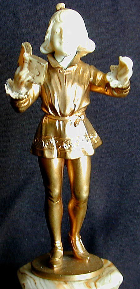 HANS KECK (EARLY 20THC GERMAN) BRONZE IVORY SCULPTU: HANS KECK (EARLY 20THC GERMAN) BRONZE IVORY SCULPTURE A fine gilt bronze and ivory chryselephantine sculpture by the early 20thc German sculptor Han Keck, modeled as a young elegant boy reciting from