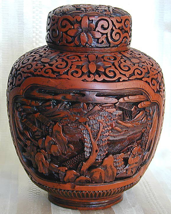 ANTIQUE CHINESE CINNABAR JAR An antique Chinese ci: ANTIQUE CHINESE CINNABAR JAR An antique Chinese cinnabar covered jar, 6.5"H, carved with 2 panels of scholars in a pavilion background, marked CHINA on base and with old numerical label, good conditio