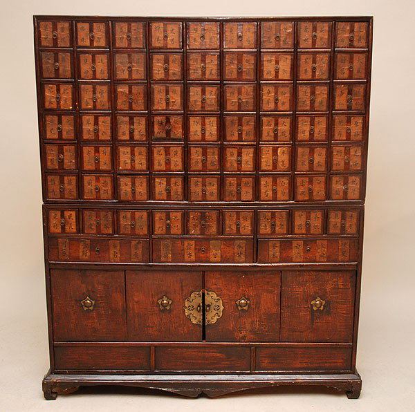 Chinese apothecary chest with identification on ea: Chinese apothecary chest with identification on each drawer front, c. 1900, secret drawers and sliding doors bracket for base, 46 1/2"h x 38"w
