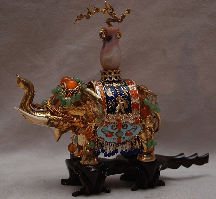 CHINESE SILVER AND ENAMEL elephant with jade & jew: CHINESE SILVER AND ENAMEL elephant with jade & jewels and hard stone on top, ivory tusks, 5"x5" on wood stand