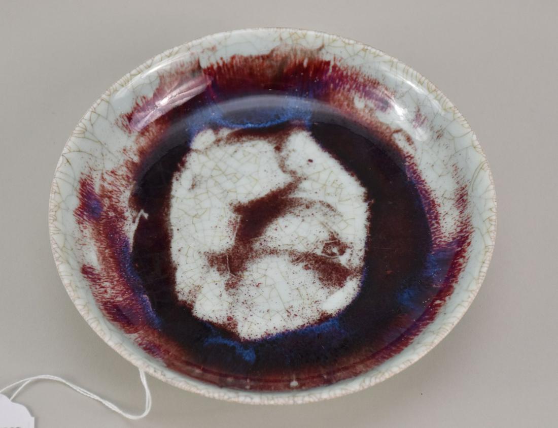 Chinese Flambe Glaze Porcelain Plate - A shallow bowl with flambe glaze on a celadon ground, with: Chinese Flambe Glaze Porcelain Plate - A shallow bowl with flambe glaze on a celadon ground, with craquelure. Six-character mark within double ring in blue underglaze. 7 1/8" dia.