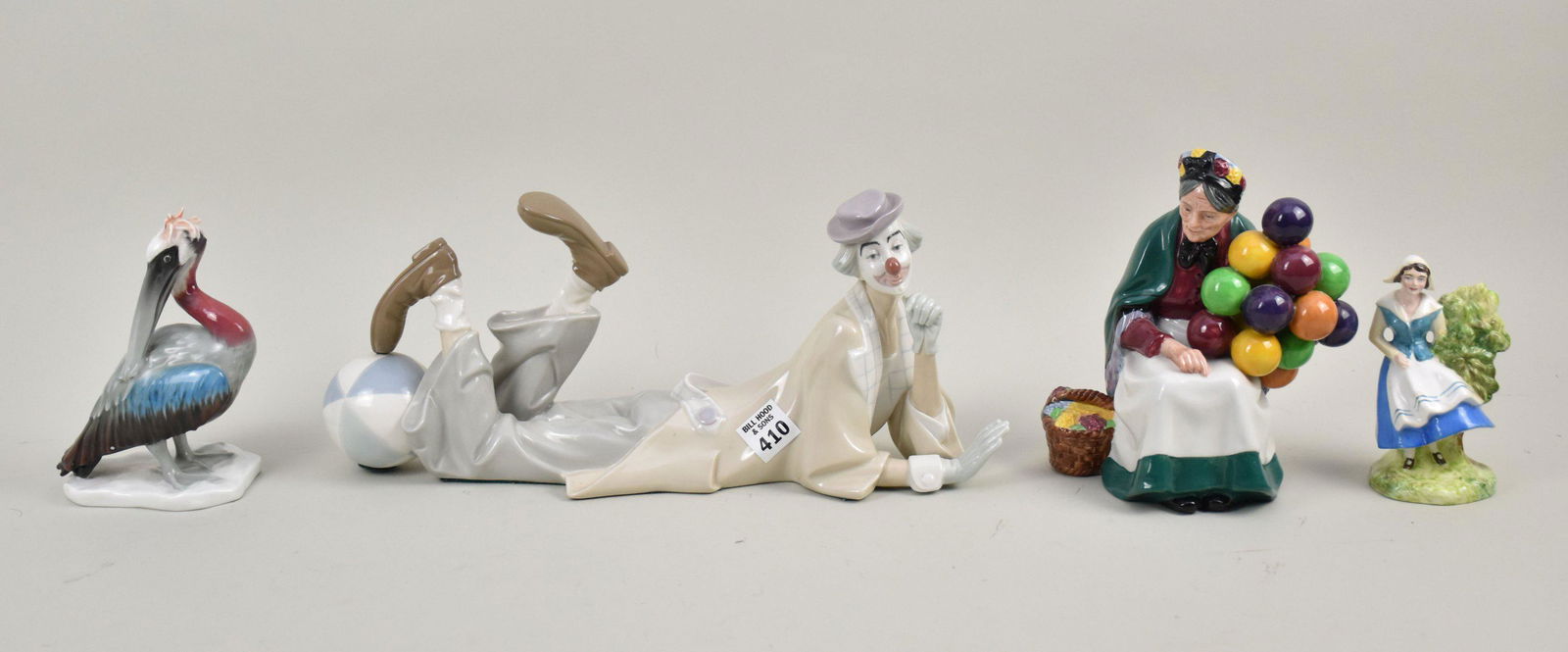 4 Porcelain Pieces, Lladro Reclining Clown (14"L), Royal Doulton "The Old Balloon Seller" (7 1/2"h), (1 of 9)