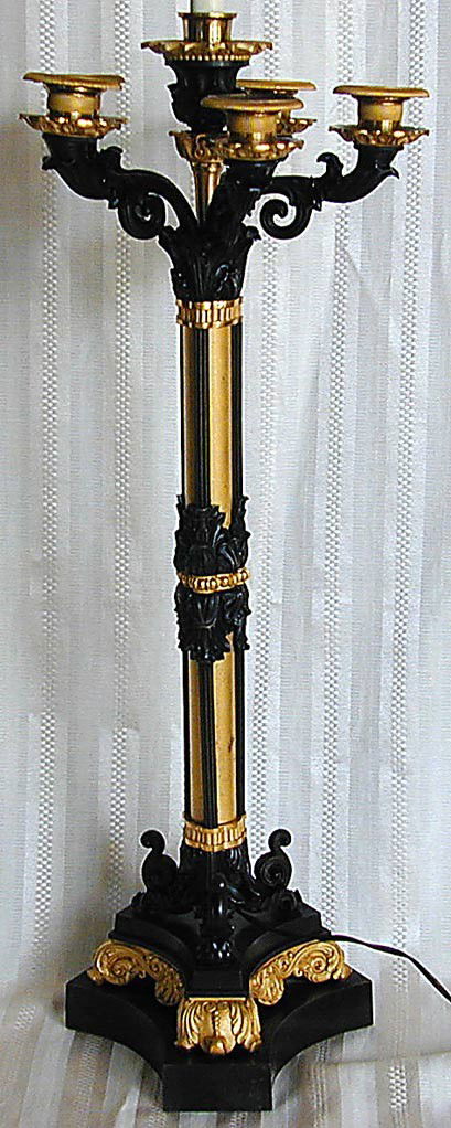 FINE 19THC 2-TONE BRONZE/DORE CANDLEABRA LAMP 37.5: FINE 19THC 2-TONE BRONZE/DORE CANDLEABRA LAMP 37.5"H A finely cast dark brown and dore bronze candelabra now mounted as a lamp, the columnar form cast on three feet mounted on a floral plinth, 37.5"H