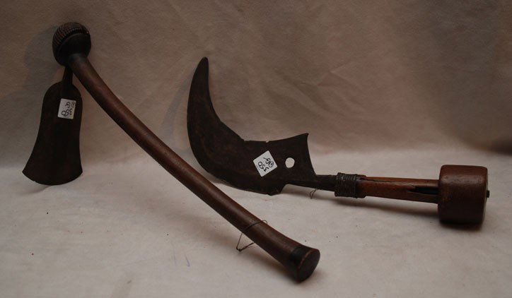 Steel sickle blade mounted, wood handle, 16"h and: Steel sickle blade mounted, wood handle, 16"h and African carved handle, shaped and decorated blade, 18"h