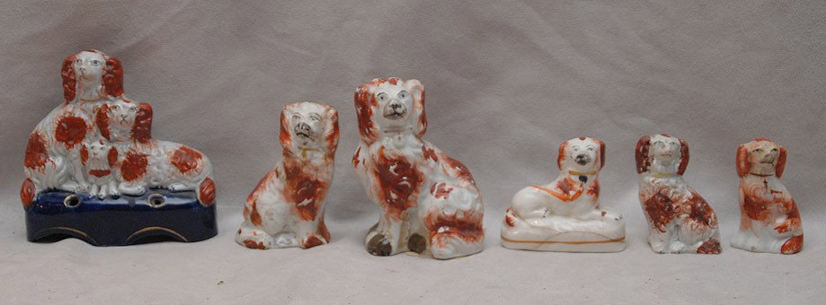 6 assorted small Staffordshire red seated Spaniels: 6 assorted small Staffordshire red seated Spaniels and pen holder grouping