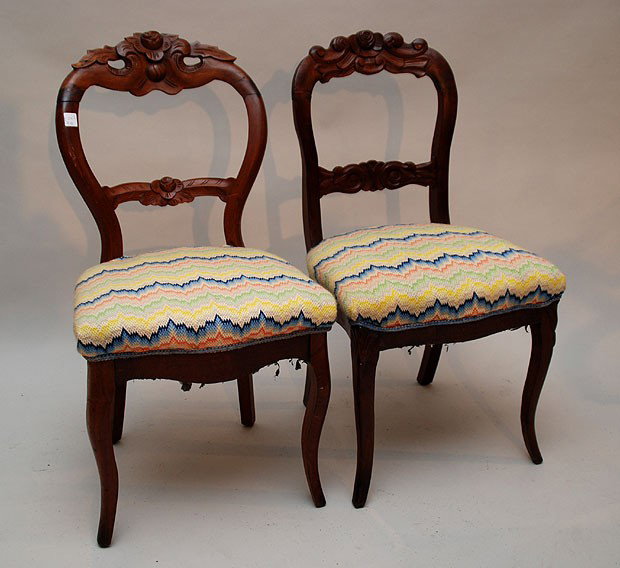 Pair Victorian carved side chairs with a needlepoi: Pair Victorian carved side chairs with a needlepoint multi color seat