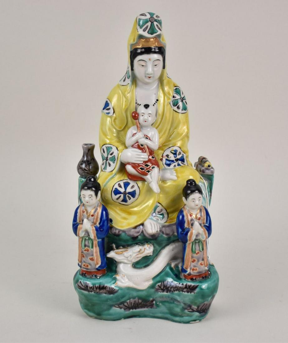 Chinese Porcelain Figural Group of Guanyin - A polychrome glazed porcelain figure of a seated (1 of 8)