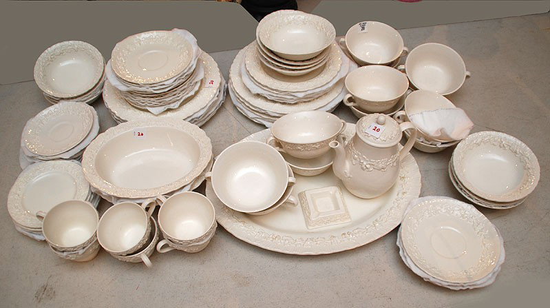 Wedgwood dinner service, raised grape and leaf moti: Wedgwood dinner service, raised grape and leaf motif, cream color, incl; 10 dinner plates, 5 dessert/luncheon plates, 12 soups, 12 soup liners, 11 bowls, 6 cups, 12 saucers, 1 oval platter, 2 open veg
