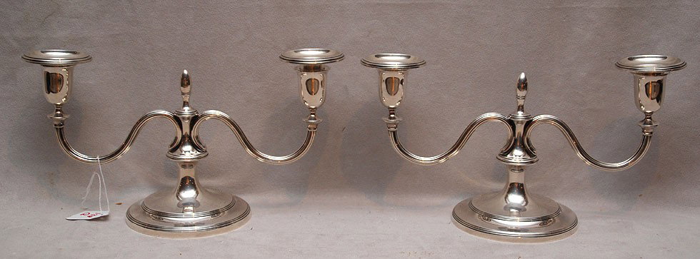 Pair of Tiffany & Co. sterling silver two branch c: Pair of Tiffany & Co. sterling silver two branch candelabra, c. 1950, marked "Tiffany and Co. #22952" each with finial and footed base, 6 1/2"h x 11"w