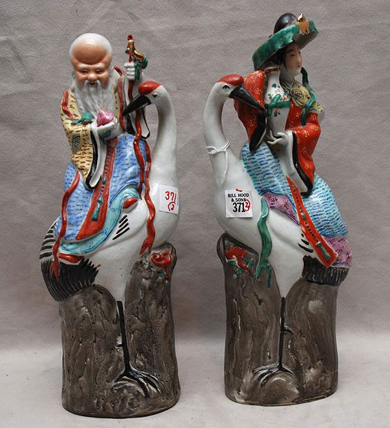 Pair of oriental porcelain man and woman riding th: Pair of oriental porcelain man and woman riding the cranes, 15"h