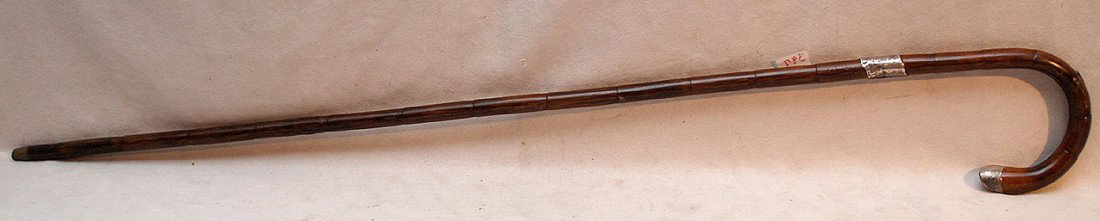 2 Continental bamboo canes revealing daggers, one : 2 Continental bamboo canes revealing daggers, one has sterling bands with monogram and date, other with horn handle, 35"L and 36"L