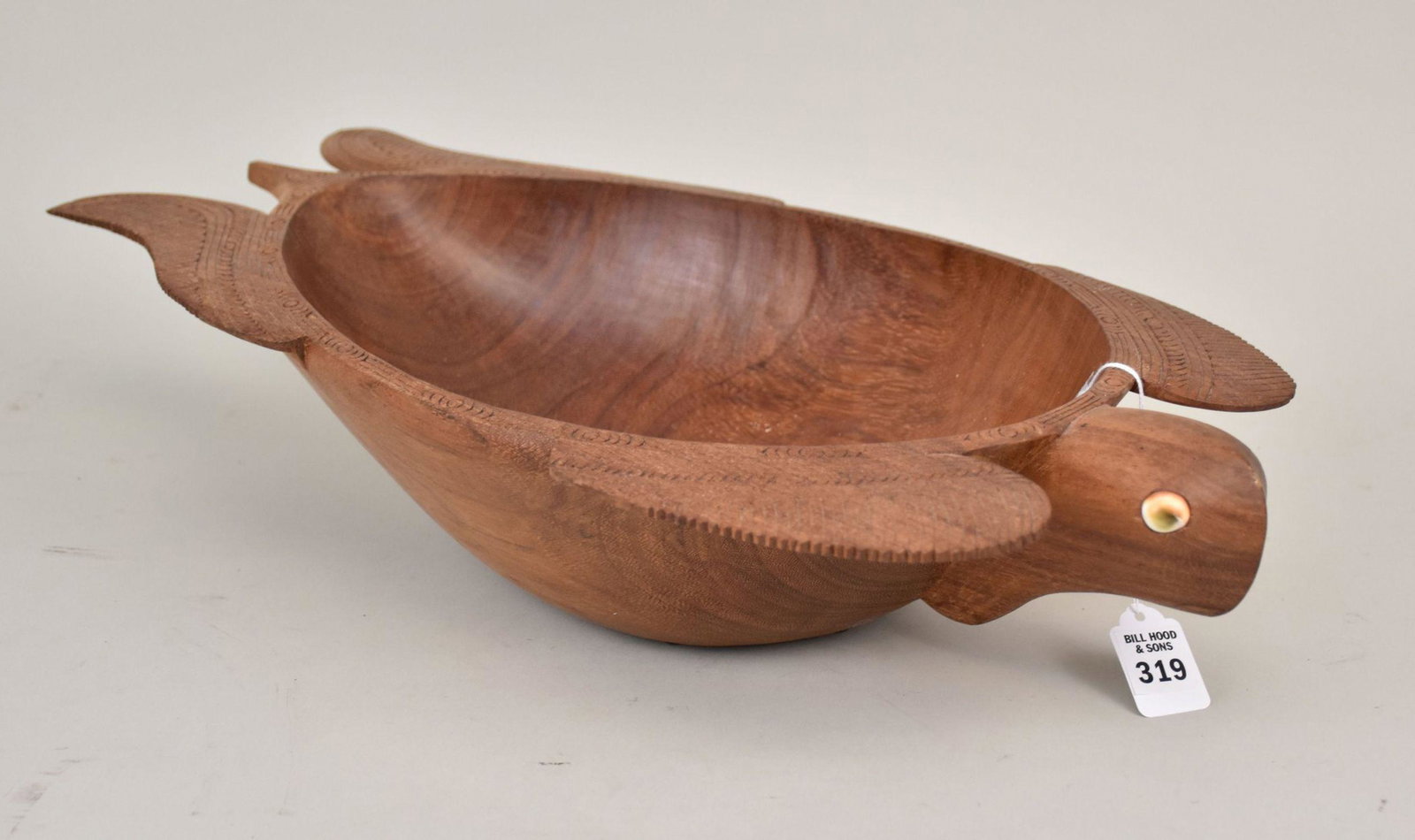 Melanesian Carved Wood Bowl in the Form of a Turtle - Created by local artists of the Triobriand: Melanesian Carved Wood Bowl in the Form of a Turtle - Created by local artists of the Triobriand Islands, this Kwila Hardwood bowl is carved into the form of a turtle and inlaid with shell eyes. 4 3/4