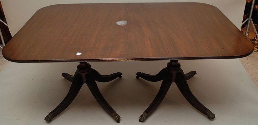 Mahogany double pedestal Duncan Phyfe table, (has m: Mahogany double pedestal Duncan Phyfe table, (has marred circle from heat and some wear along edges) 29"h x 66"w x 43"d