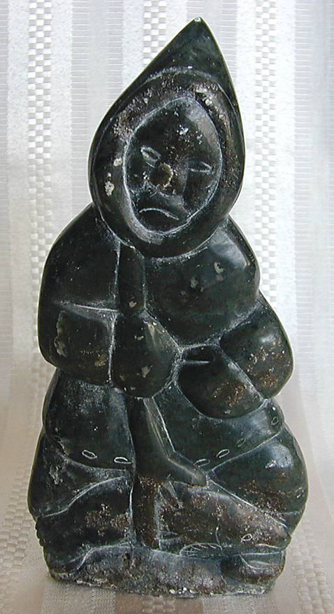 OLD INUIT SOAPSTONE FIGURE Eskimo Inuit male figur: OLD INUIT SOAPSTONE FIGURE Eskimo Inuit male figure with a caught seal, 7""H x 3.5""W, old tags."