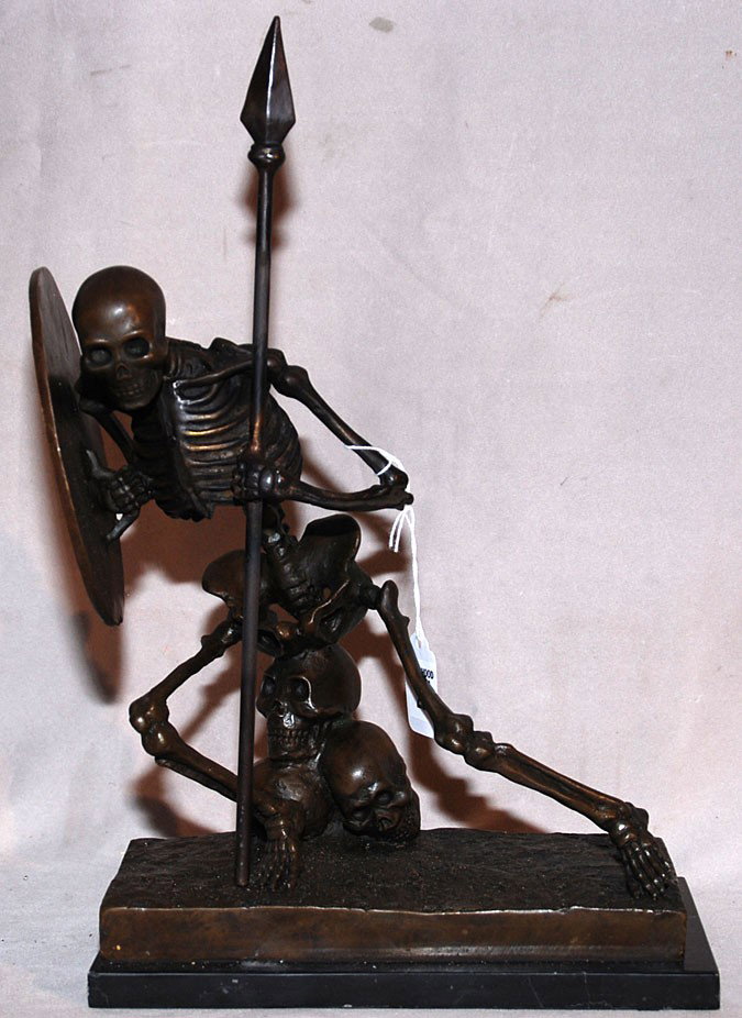 Bronze skeleton warrior with decorated shield on a: Bronze skeleton warrior with decorated shield on attached stand, 13"h x 8 1/2"w (without stand)