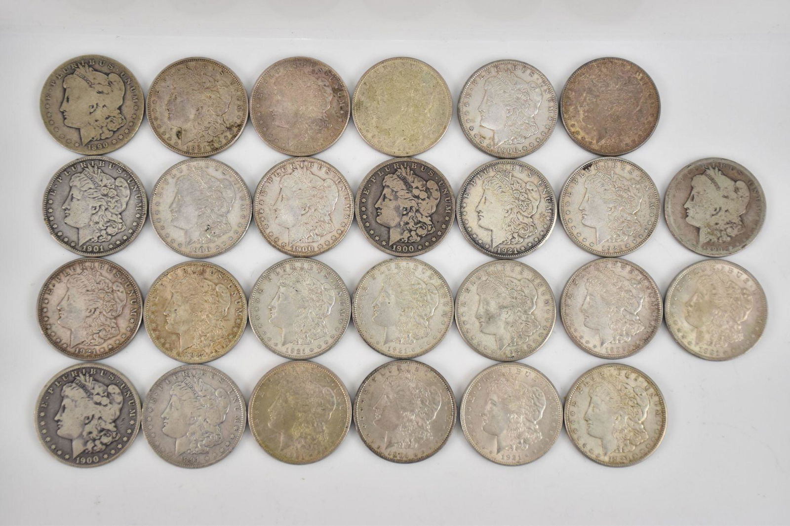 26 Silver Morgan Dollars 1885, (2) 1890 O, 1891 O, (2) 1900 O, (3) 1900, 1901 O, 1904, (8) 1921, (3) (1 of 12)