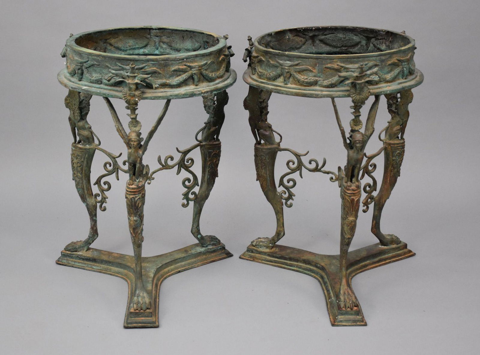 Pair Pompeiian Grand Tour Bronze Gueridon Tables, tripod legs with pawed feet, each topped with a: Pair Pompeiian Grand Tour Bronze Gueridon Tables, tripod legs with pawed feet, each topped with a Grecian-style sphinx, sans tops, 28" h x 20" w.