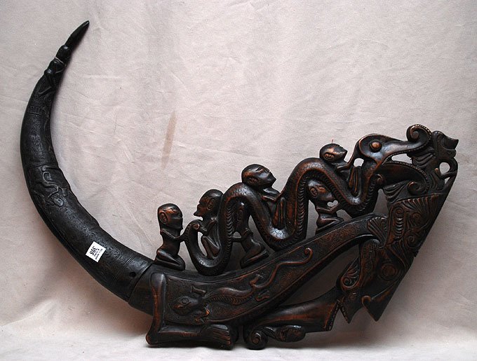 African Carved horn fits into wood carving: African Carved horn fits into wood carving, horn is 20"L and wood carving is 23"L (horn has crack at top going down 1/4 of the horn, mostly visible from the inside)