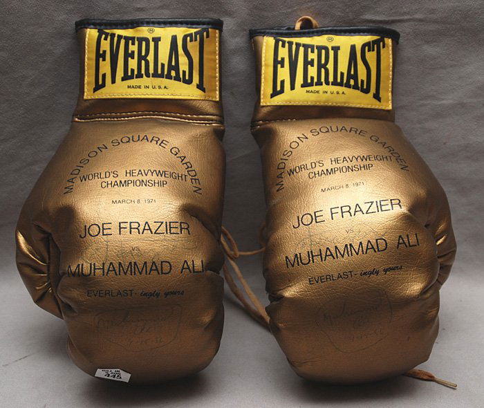 Pair of Everlast boxing gloves "Muhammad Ali 4/15/: Pair of Everlast boxing gloves "Muhammad Ali 4/15/57" dedicated March 8, 1971, Joe Frazier VS. Muhammad Ali, no authentication, 12"L