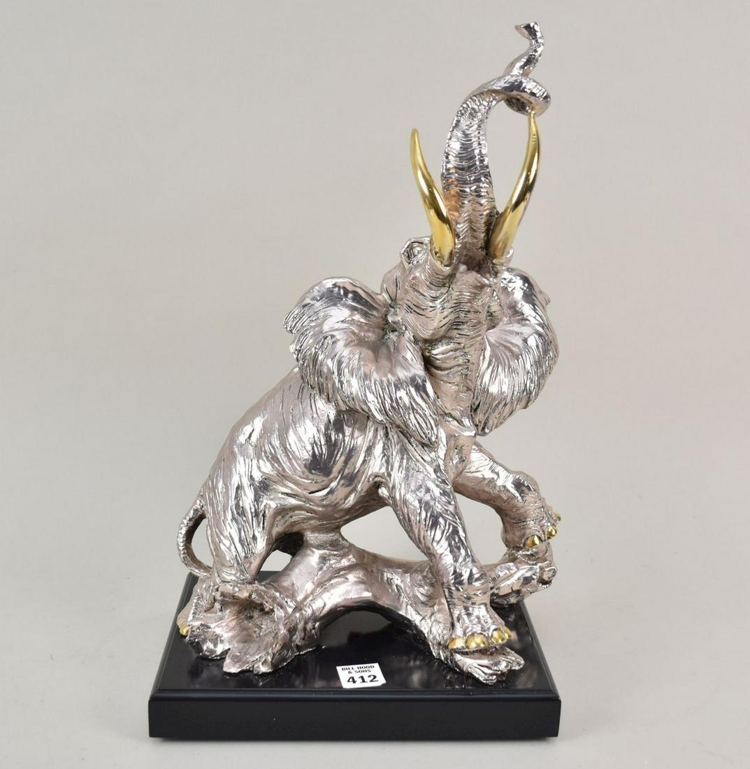 Vintage Elephant Sculpture with Sterling Silver Overlay - A sterling silver clad sculpture of an (1 of 10)