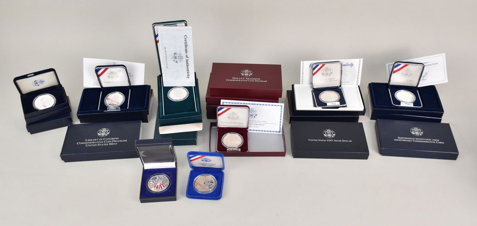 16 - Silver Dollars. (2) 2000 American Eagle, 1986 Ellis Island Coin, 1999 Colorized Silver eagle, (1 of 7)