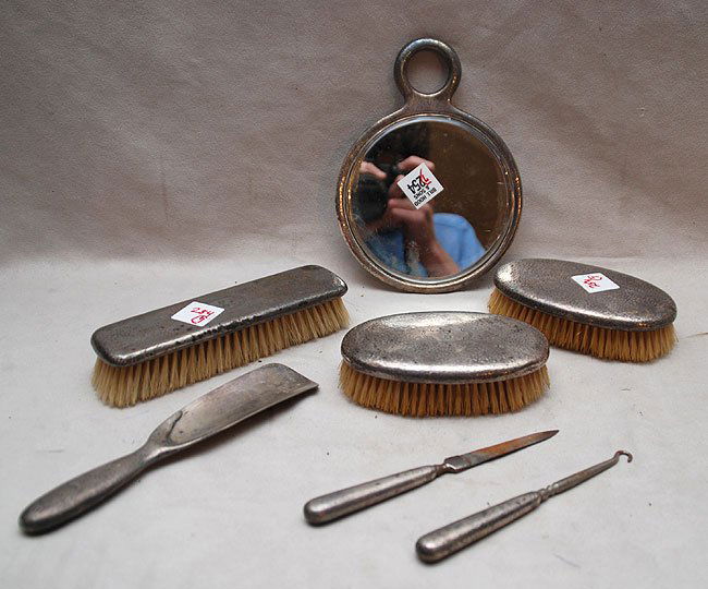 7pc. Sterling "Tiffany & Co. dresser set, incl; 3: 7pc. Sterling "Tiffany & Co. dresser set, incl; 3 brushes, hand mirror, nail file, shoe hook and shoe horn