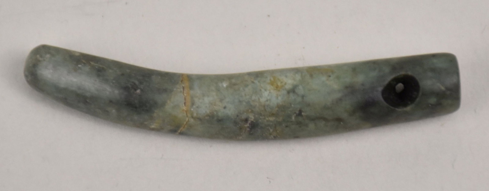 Pre-Columbian Mayan Jade Tooth Pendant - Carved green Pre-Columbian jade pendant, drilled holes for: Pre-Columbian Mayan Jade Tooth Pendant - Carved green Pre-Columbian jade pendant, drilled holes for cord. 2 3/8" L.
