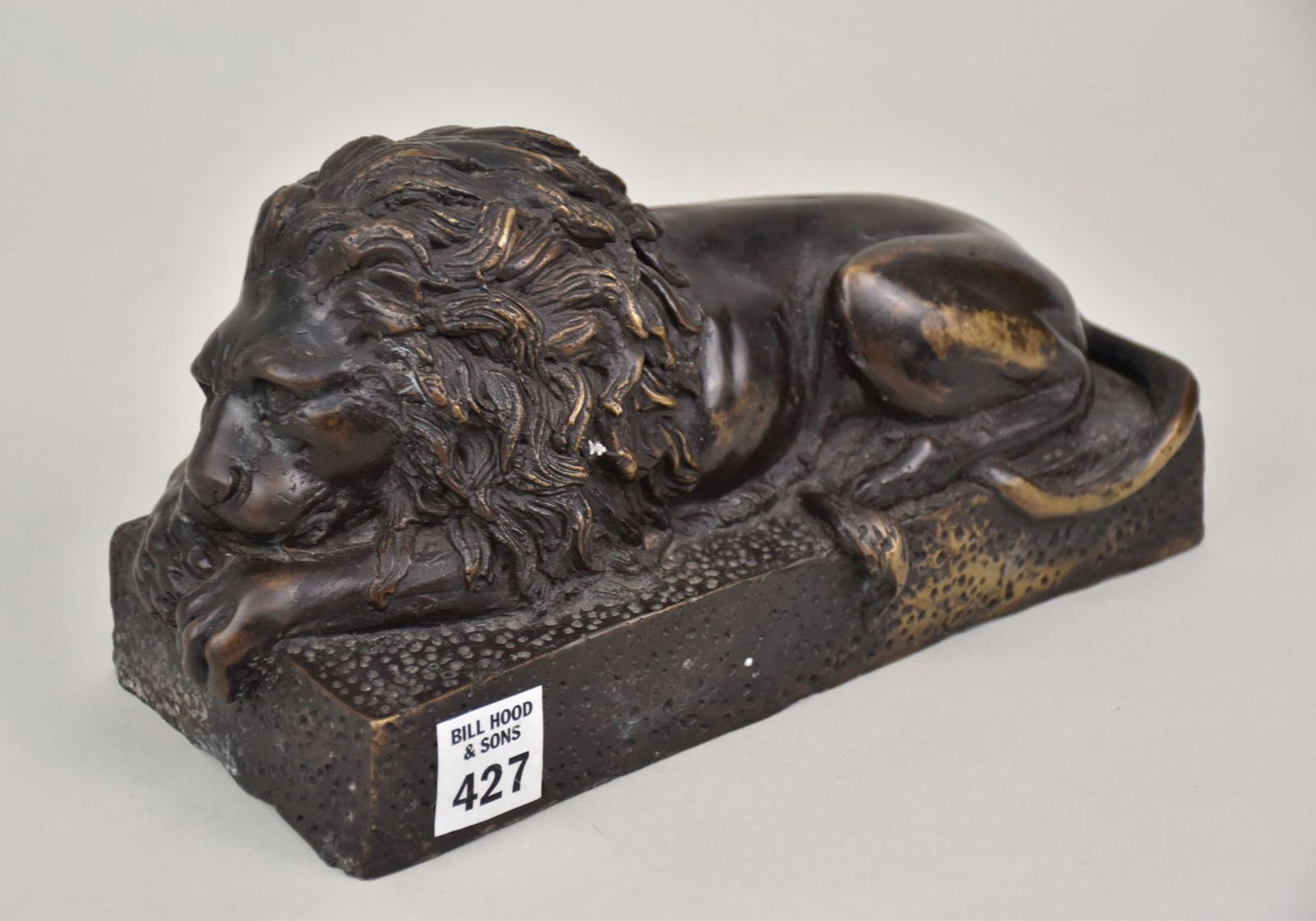 Bronze Lion in the Style of Antonio Canova - A recumbent lion figure on a stipled platform base. 4 (1 of 4)