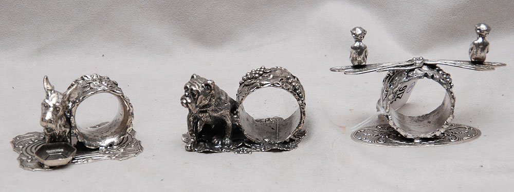 3 Silver plated Figural Napkin Rings. Condition: : 3 Silver plated Figural Napkin Rings. Condition: good. Largest Wth. 4 1/2"