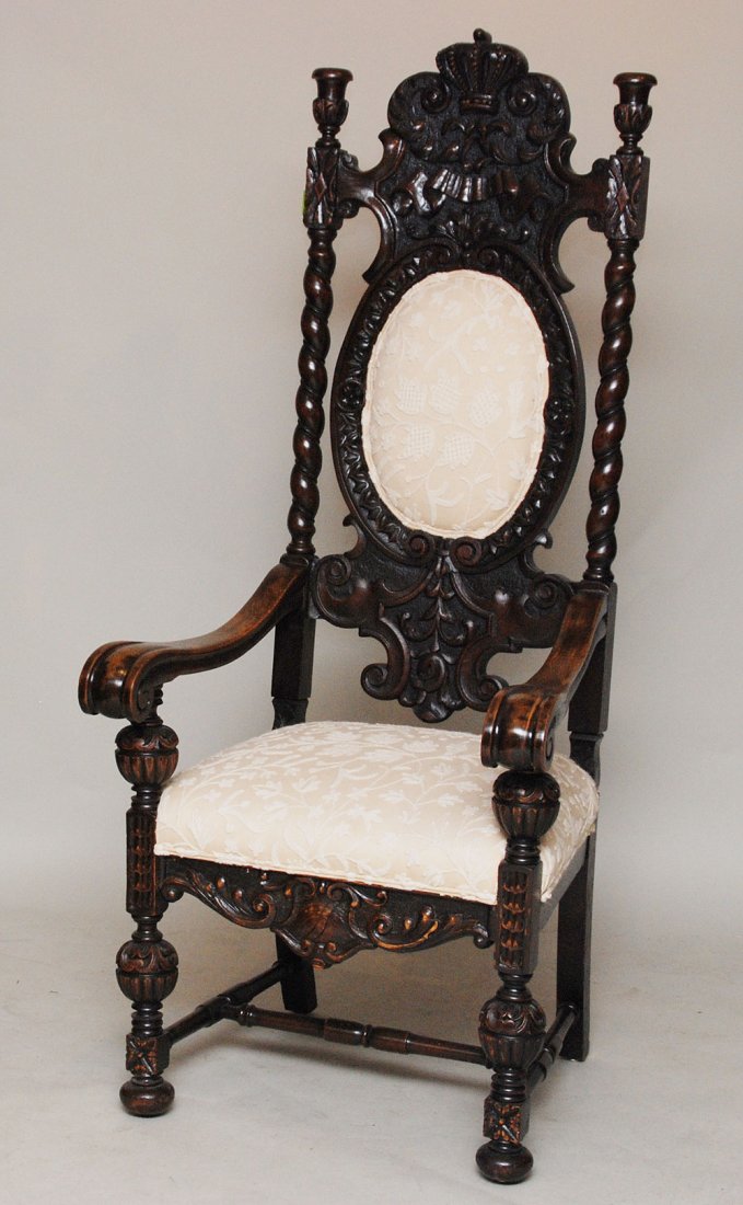 Spanish heavily carved throne chair with ivory uph: Spanish heavily carved throne chair with ivory upholstery, 64 3/4"h x 28"w