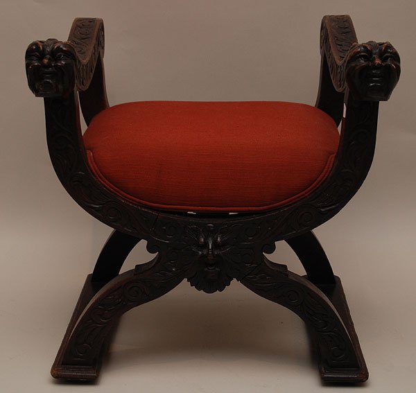 Spanish colonial stool, carved lion heads at hand : Spanish colonial stool, carved lion heads at hand rests on curule base, 27"h x 25"w