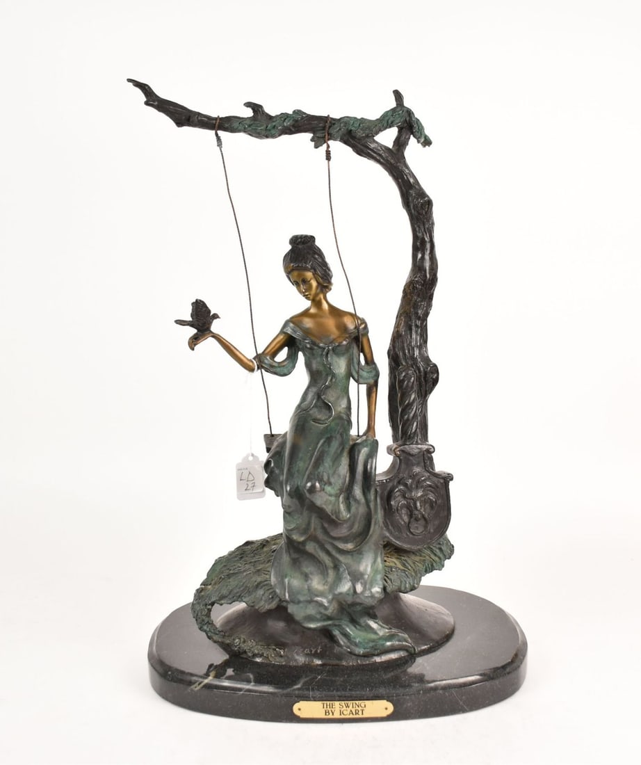 "The Swing" After Icart Bronze Sculpture - A patinated bronze depicting a young woman on a swing: "The Swing" After Icart Bronze Sculpture - A patinated Large Bronze depicting a young woman on a swing with a dove on her hand. Modeled after Louis Icart. Mounted on an oval black marble base with pla