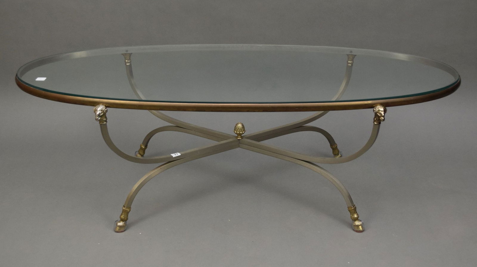 Modern Jansen Oval Glass Top Coffee Table on Steel Base with Ram Head & Feet (1 of 7)