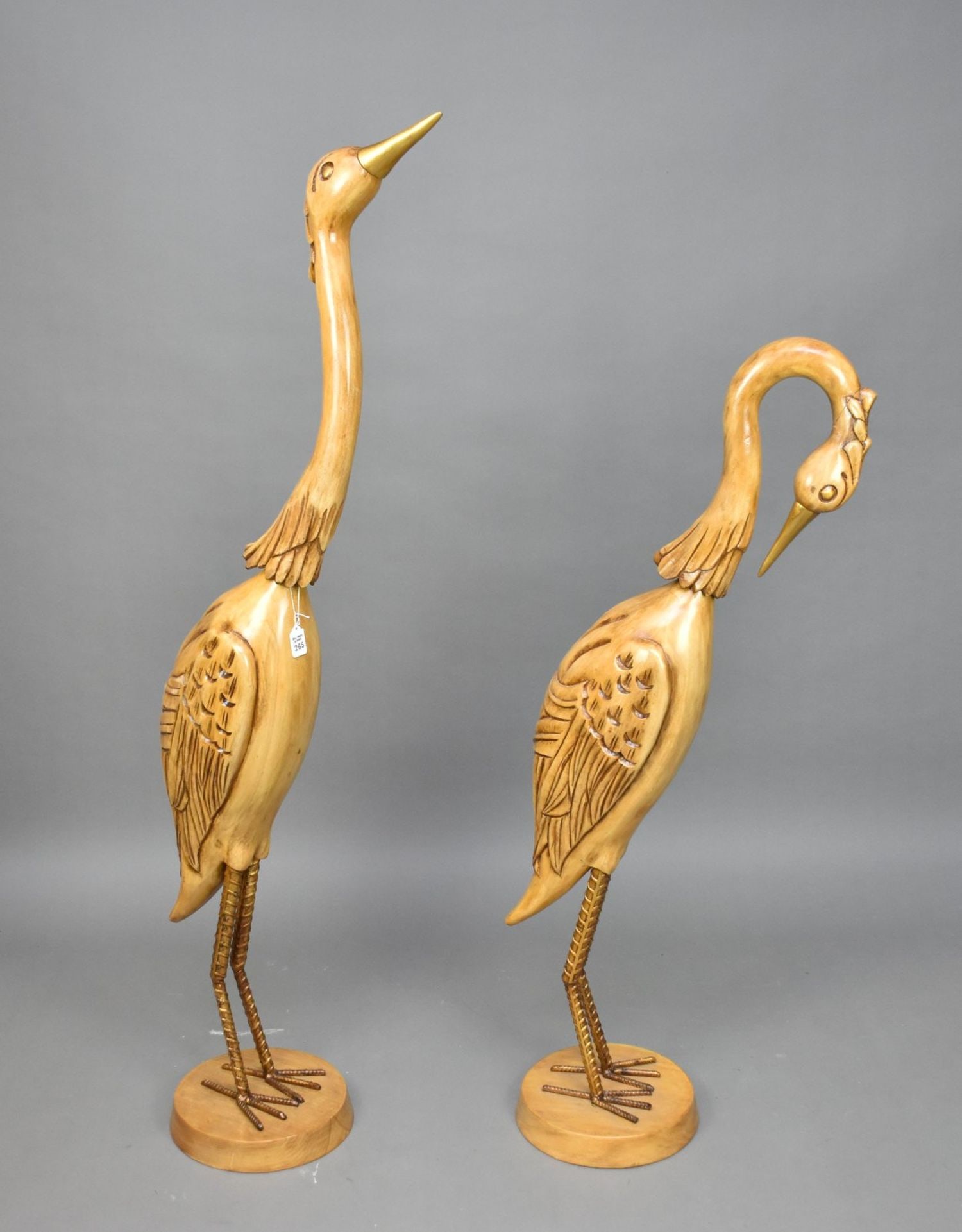 Pair Carved Wood Standing Cranes with Brass Beaks & Metal Legs, 60"h (one neck repair): Pair Carved Wood Standing Cranes with Brass Beaks & Metal Legs, 60"h (one neck repair)