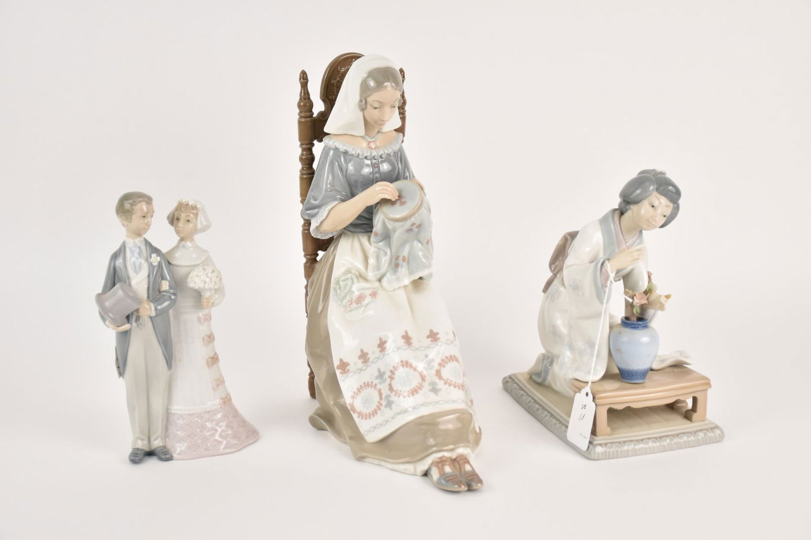 Three Lladro Porcelain Figures - Spain. Group of three Lladro glossy finish figurines including: A) (1 of 7)