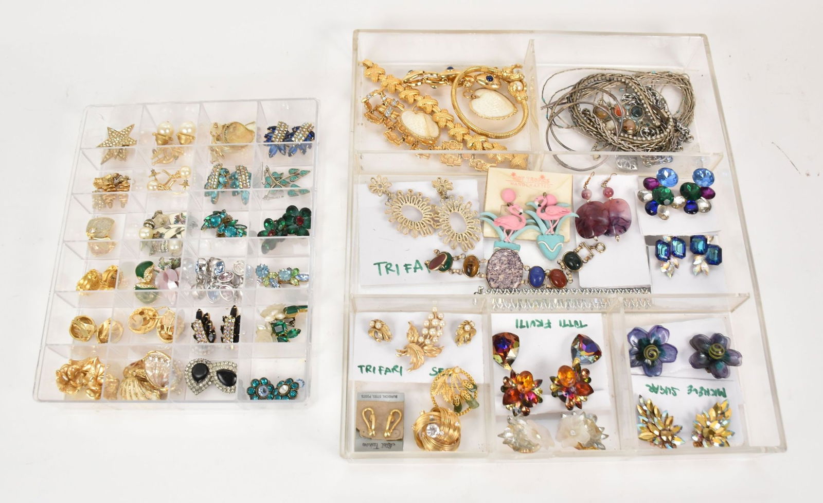 Costume Jewelry Lot. Trifari, Kramer, Ciner, Michele Sugar, Tutti Frutti, includes bracelet,: Costume Jewelry Lot. Trifari, Kramer, Ciner, Michele Sugar, Tutti Frutti, includes bracelet, earrings, pendants and broches. Not all pieces are signed. Trays are not included