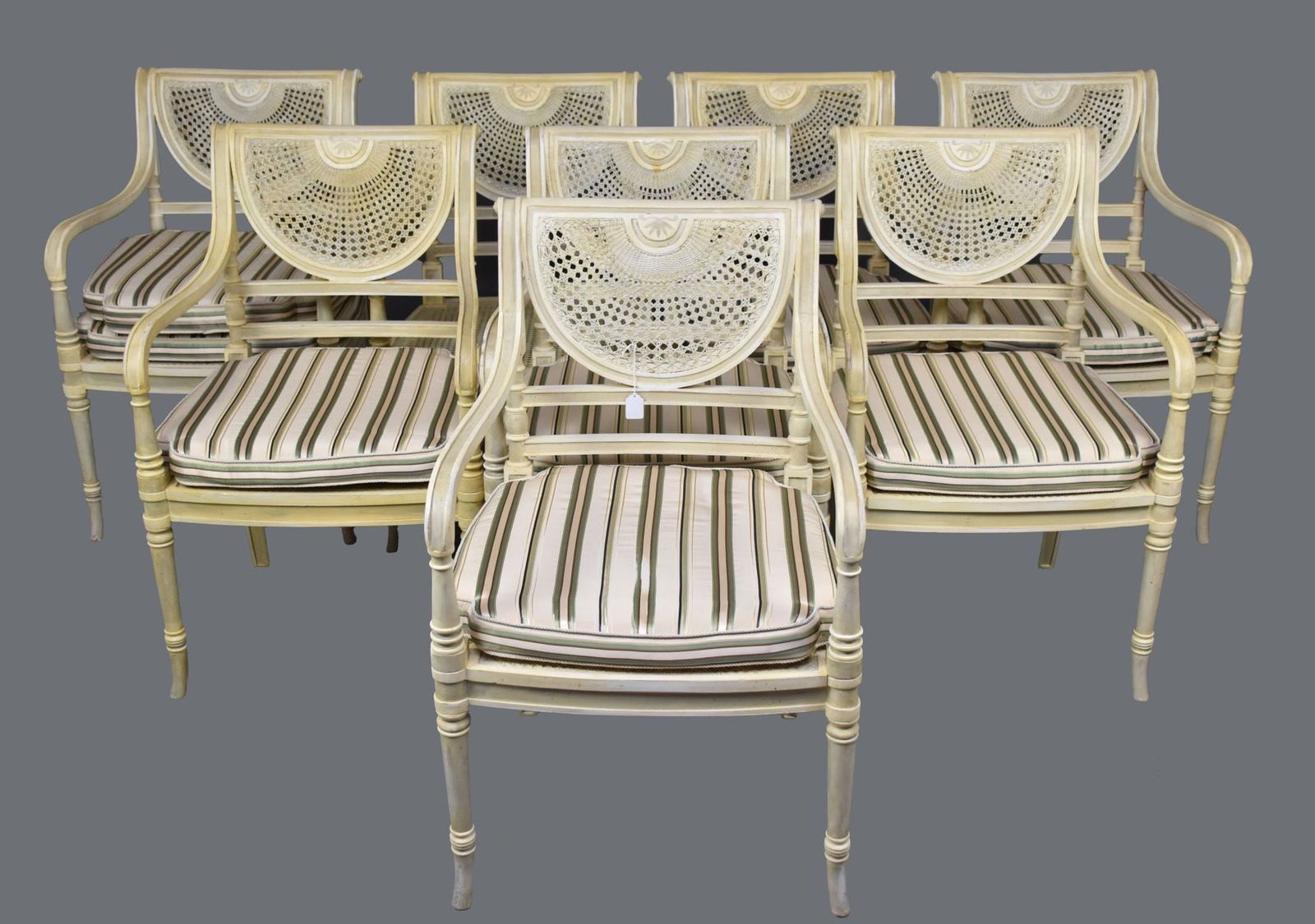 Set of Eight Regency Style Caned and Painted Armchairs 20th Century. Each with loose seat cushion, (1 of 5)