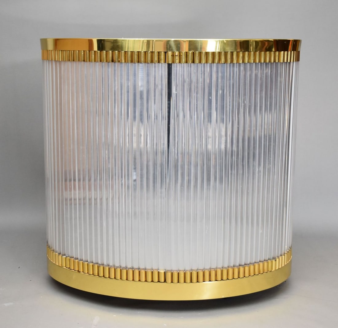 Modern Oval Shaped Gilt with And Acrylic Bar: Modern Oval Shaped Gilt with And Acrylic Bar Cabinet The top inset with an oval mirror above a pair of cupboard doors. Height 35”. Length 36”. Depth 26”.