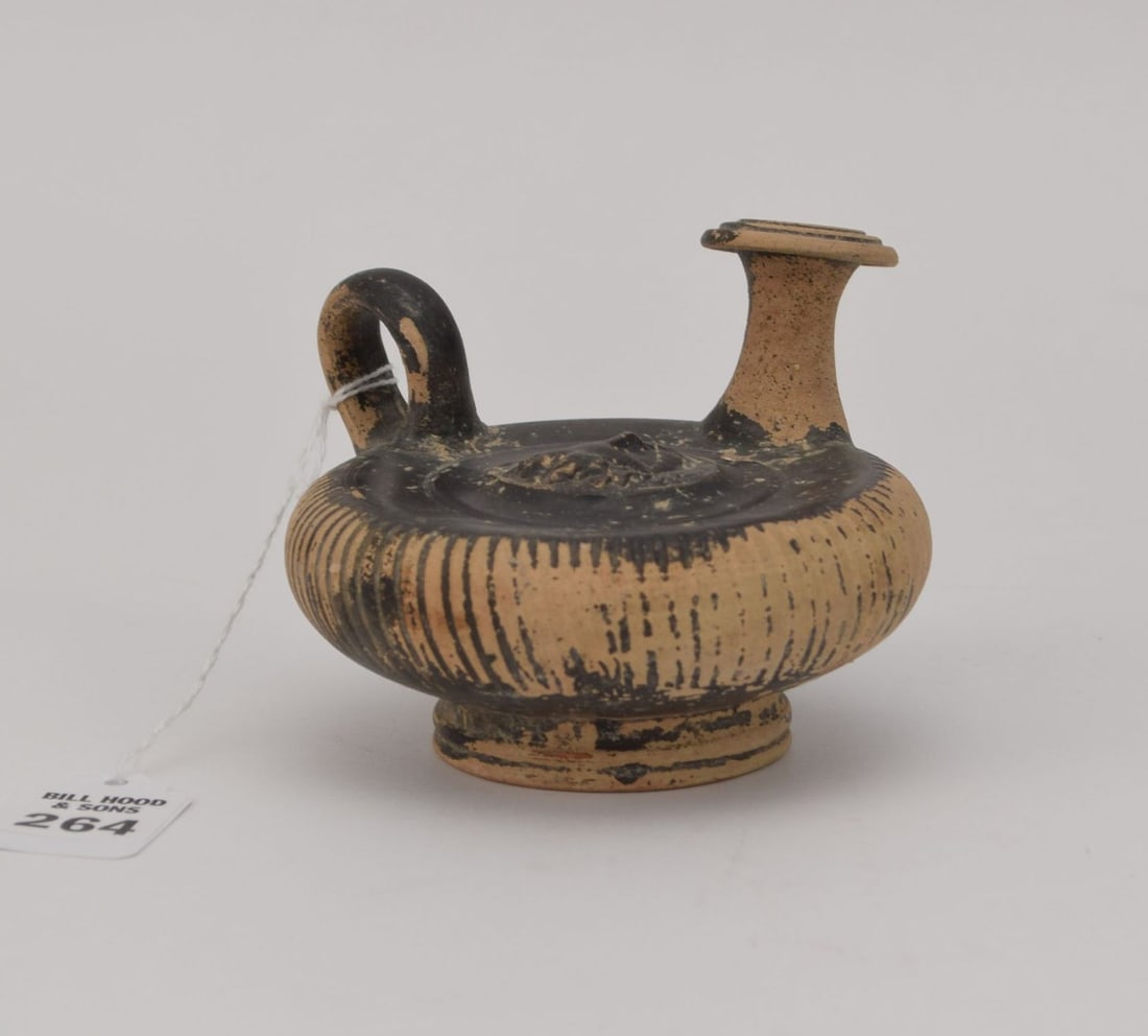 A Hellenistic Calene Blackware Guttus w/ Head of Medusa, c.4th Century BC - Southern Italian, (1 of 5)