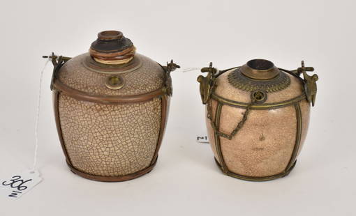 Two Crackle Glazed Ceramic Opium Pipes, 19th Century - Two ceramic water pipes with a buff crackle: Two Crackle Glazed Ceramic Opium Pipes, 19th Century - Two ceramic water pipes with a buff crackle glaze and brass mountings. Each with a handle and decorative support mounts. One with chain and clean