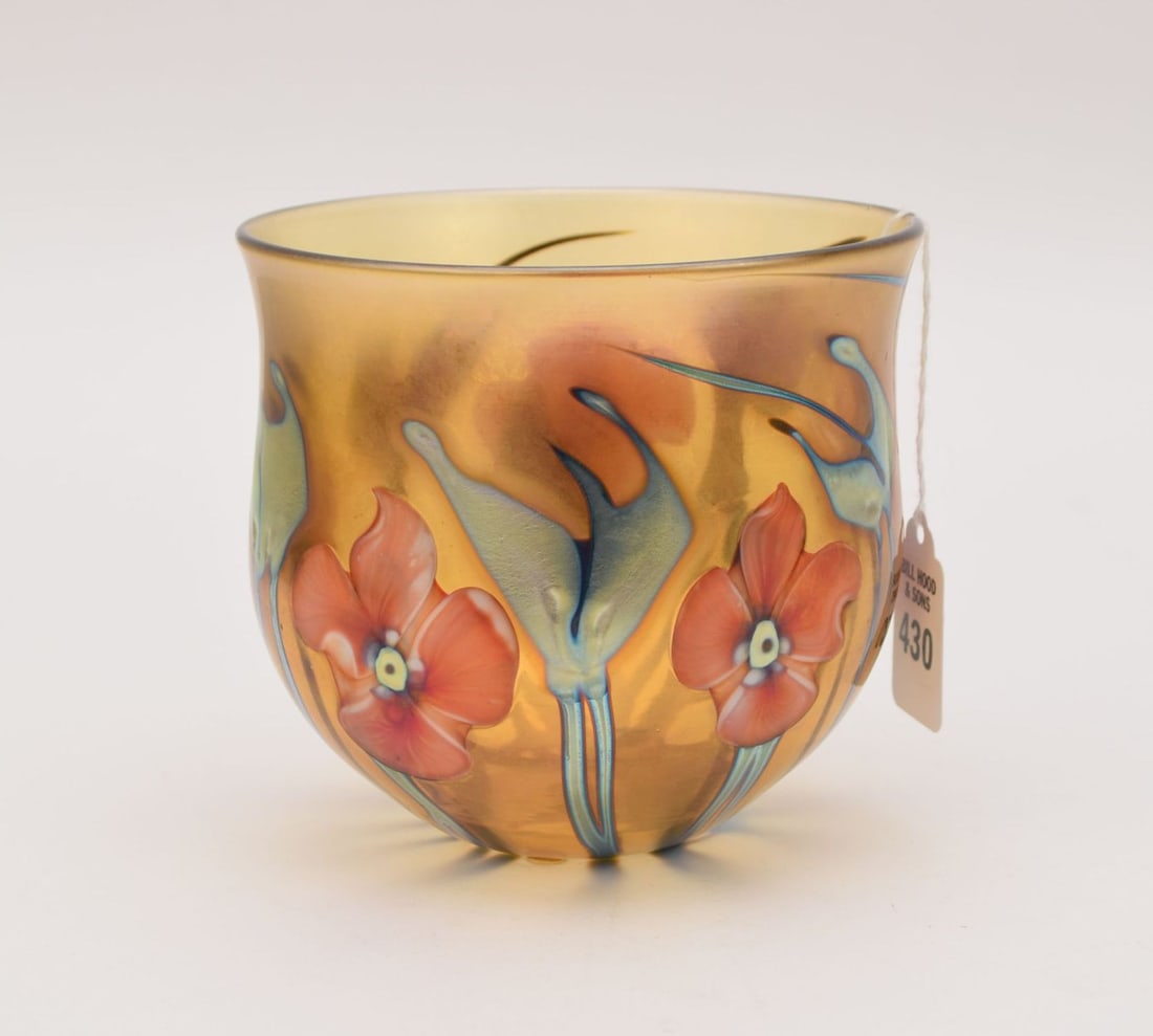 Signed Charles Lotton Art Glass Flora Vase - C. 1980. A Flora art glass vase by Charles Lotton. Pink: Signed Charles Lotton Art Glass Flora Vase - C. 1980. A Flora art glass vase by Charles Lotton. Pink pansy flowers and green iridescent leaves on an amber ground, all over iridescence to surface. Sign