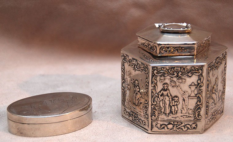 2 pieces sterling, incl; hexagonal tea caddy with : 2 pieces sterling, incl; hexagonal tea caddy with figures in relief, 4oz and oval Continental pill box, monogram, 1oz