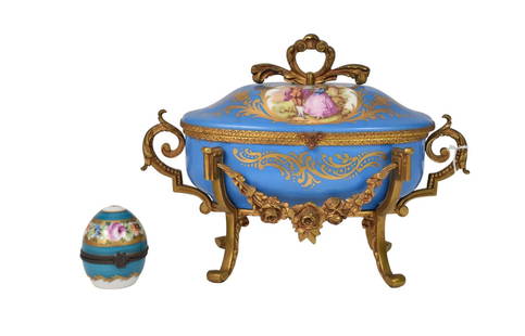 French Sevres Style Porcelain Jewelry Box & Perfume Egg - A porcelain jewelry box with scenes of a: French Sevres Style Porcelain Jewelry Box & Perfume Egg - A porcelain jewelry box with scenes of a young romantic couple, blue ground with gilt accents, gilt bronze mountings, maker mark under lid wit